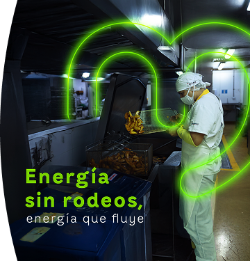 Funcionario de EPM Comercializadora trabajando en cocina industrial con gráfica neón de energía al fondo
