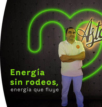 Funcionario de EPM Comercializadora junto a letrero neón con mensaje “Energía sin rodeos, energía que fluye”